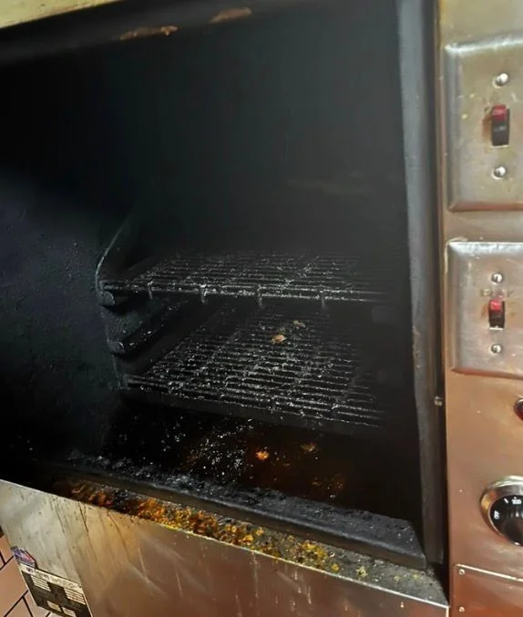 Grease-caked commercial oven interior before a deep clean in Tampa, FL