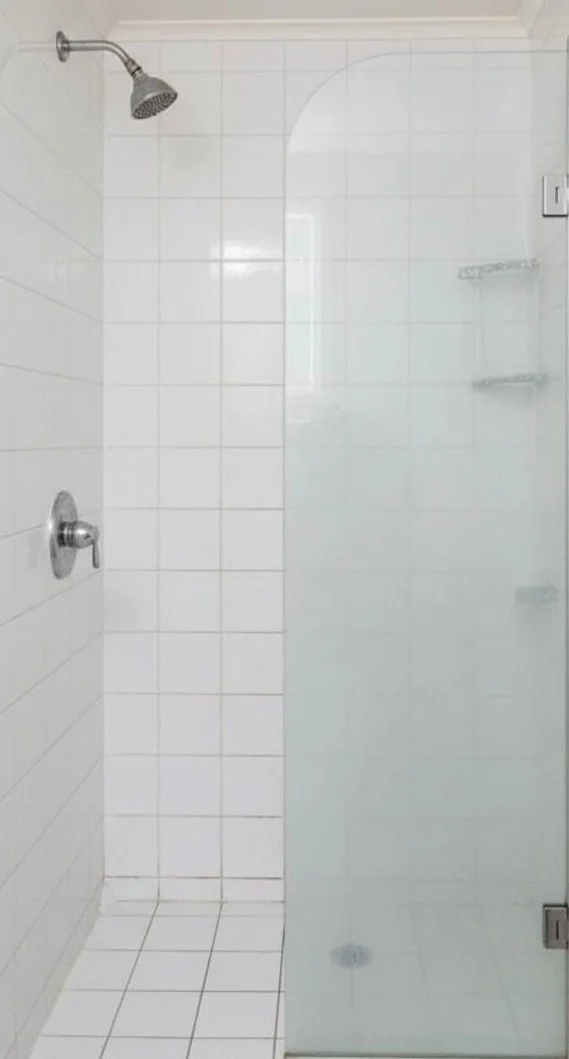 Bathroom shower tile with clean, bright grout after a cleaning in Tampa, FL
